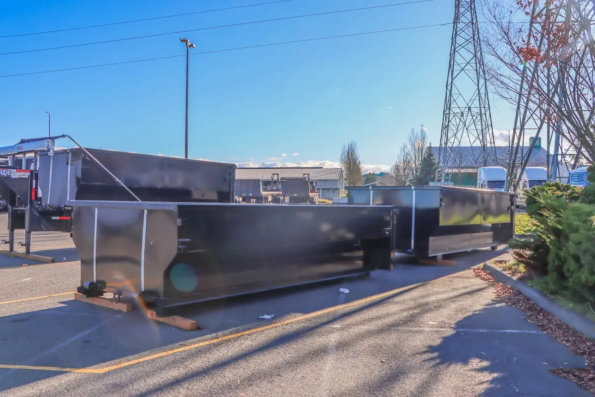 Roll-off dumpster ready for waste disposal at job site for Concrete Dumpster Rental in Florence